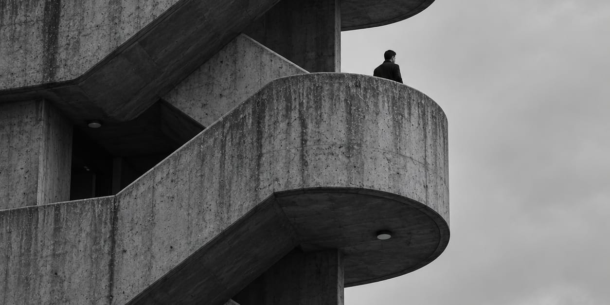 A solo man climbing a non-stop stair. Progressing, but at times lonely.
